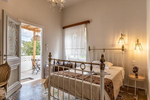 a bedroom with a bed and a window at The Locals in Káto Potamiá