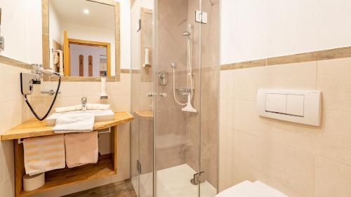 a bathroom with a shower and a sink at Demelhof in Reit im Winkl