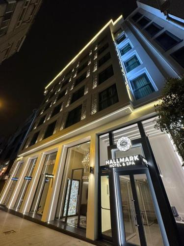 a hotel building with a sign in front of it at Hallmark Hotel & SPA Istanbul in Istanbul