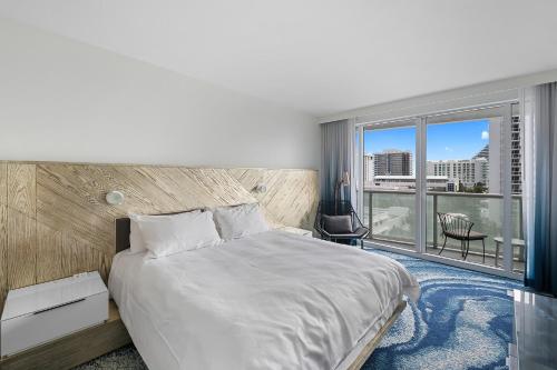 Katil atau katil-katil dalam bilik di The W Hotel Beachfront Condo Oasis