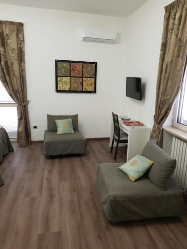a living room with a couch and a table at L'Insolita Reggia in Caserta