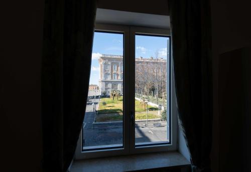 a window with a view of a building at L'Insolita Reggia in Caserta