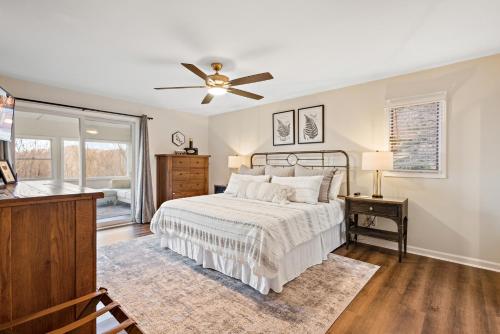 a bedroom with a bed and a ceiling fan at Sunrise Haven in Seven Devils