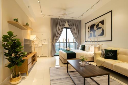 a living room with a bed and a couch at Chambers Premier Suites Kuala Lumpur in Kuala Lumpur