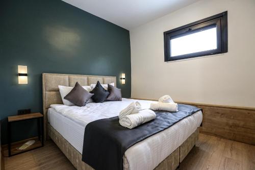 Katil atau katil-katil dalam bilik di Mia Mia Suites