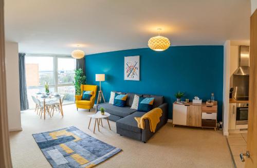 a living room with a couch and a table at Rueben Suite By Koya Homes - Cardiff in Cardiff