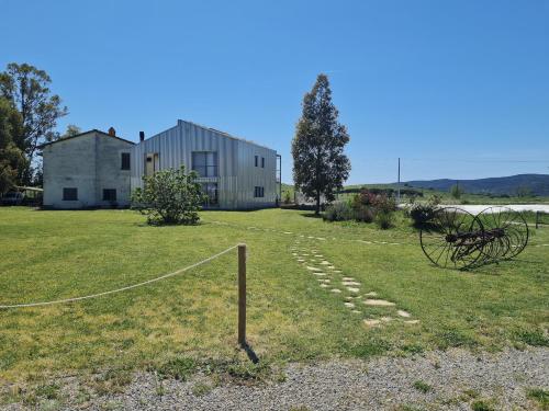 a building with a net in front of a yard at Anonima Agricola in Orbetello