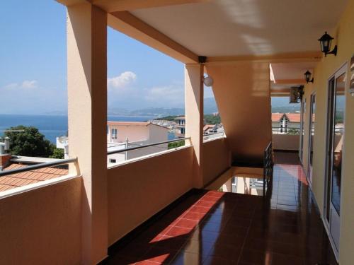 a balcony with a view of the ocean at Apartments and Studios Anicic in Utjeha