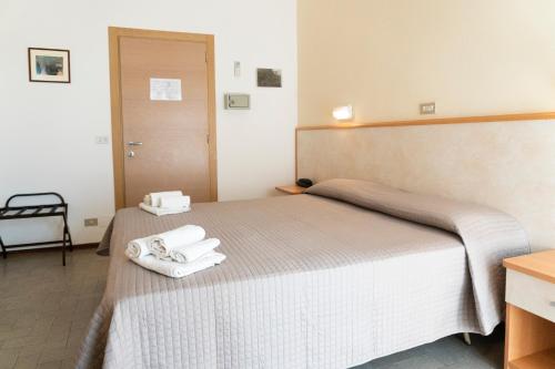 Ένα ή περισσότερα κρεβάτια σε δωμάτιο στο Hotel Martinez