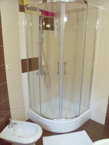 a bathroom with a shower and a toilet and a sink at Lavender cozy & lovely 17 in Split