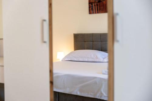 Postel nebo postele na pokoji v ubytování Blagdan apartments