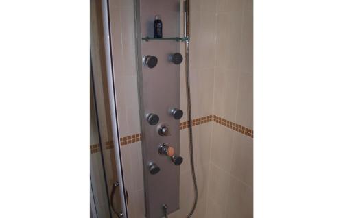 a shower with a hose in a bathroom with at 1 Bedroom Cozy Home In Neeberg in Neeberg