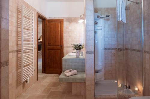 a bathroom with a shower and a sink at I trulli di Kate in Monopoli