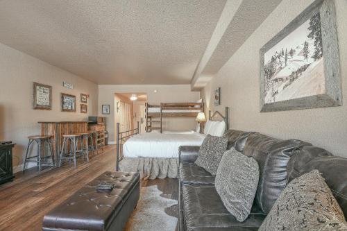 a living room with a couch and a bed at Studios in Gateway Lodge in Keystone