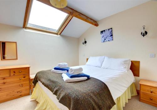 Postel nebo postele na pokoji v ubytování Wagtail Cottage