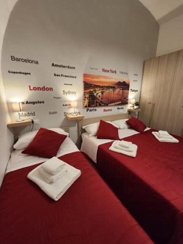 two beds sitting next to each other in a room at PURGATORIO HOUSE in Naples