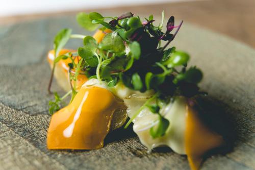 a plate of food with a plant on it at Garrya Nijo Castle Kyoto in Kyoto