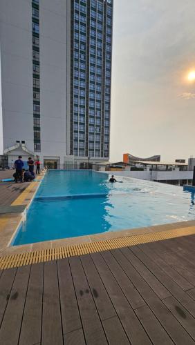 a large swimming pool on top of a building at Brand New Modern Luxury Studio Apartment at the Heart of Vientiane in Vientiane