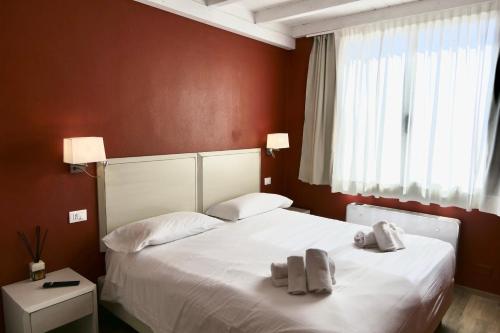 Ein Bett oder Betten in einem Zimmer der Unterkunft Il Gabbani B&B