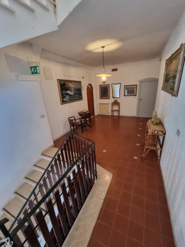a view of a hallway with a staircase in a house at Hotel Portofina in Santa Marinella