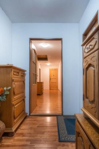 a hallway with a door leading into a room at Ranč Červený mlýn in Lisov