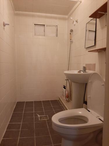 a bathroom with a toilet and a sink at TY guesthouse room 101 in Seoul