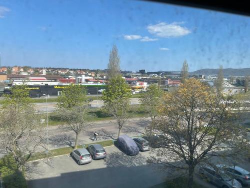 a view of cars parked in a parking lot at Twayi Luxury Suites in Jönköping