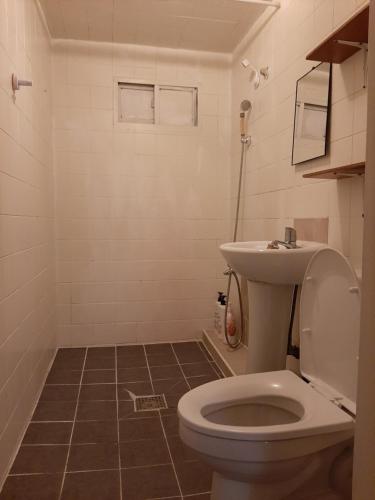 a bathroom with a toilet and a sink at TY guesthouse room 102 in Seoul