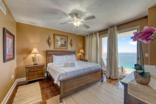 a bedroom with a bed with a view of the ocean at Treasure Island 2202 in Panama City Beach
