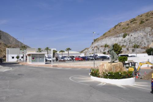 a parking lot with a statue in front of a mountain at Boutique Hotel Mamabels in Mojácar