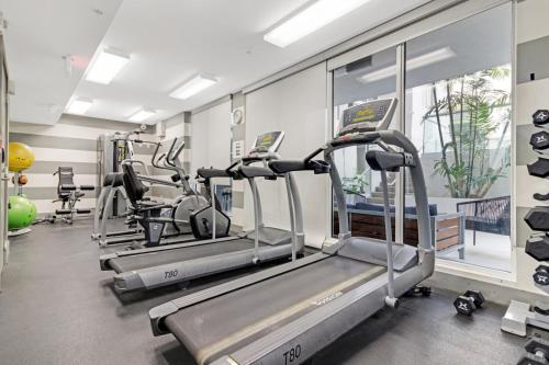 a gym with treadmills and elliptical machines at Roami at Habitat Brickell in Miami