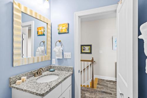 a bathroom with a sink and a mirror at Ocean Crystal A in Atlantic Beach