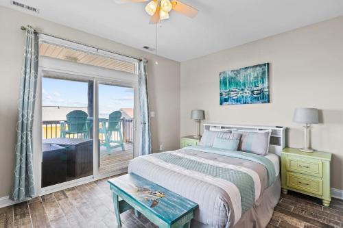 a bedroom with a bed and a large window at Ocean Crystal A in Atlantic Beach