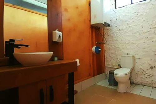 a bathroom with a sink and a toilet at Butterfly Valley Beach Glamping in Fethiye