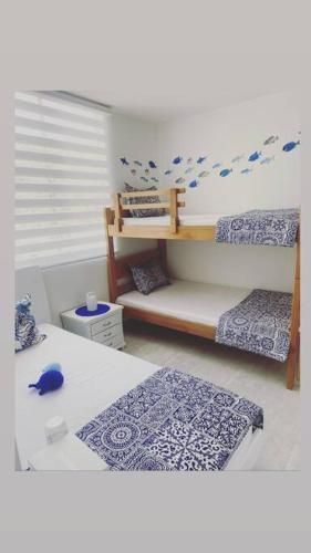 a model of a bedroom with two bunk beds at Greece In Home in Girardot