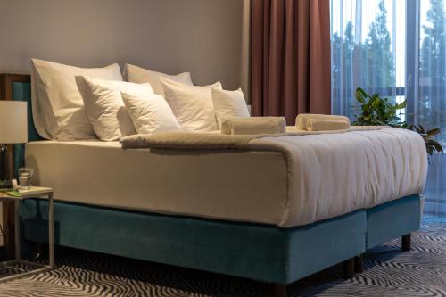 Katil atau katil-katil dalam bilik di Hotel Zoo by Afrykarium Wroclaw