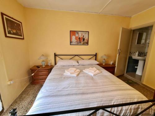 Ένα ή περισσότερα κρεβάτια σε δωμάτιο στο La Casa di Emanuela