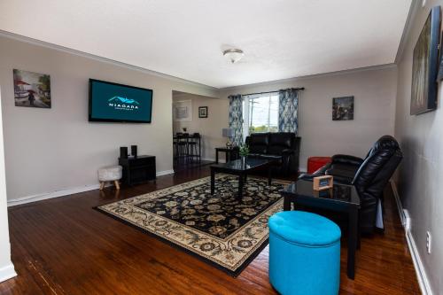 a living room with a couch and a table at Large 7BR,4BA, Short walk to Niagara Falls in Niagara Falls
