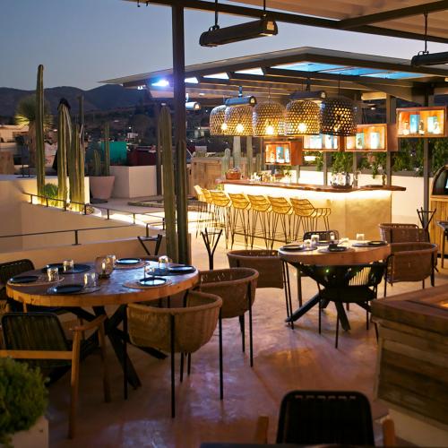 a restaurant with tables and chairs on a patio at Hotel Amatte San Miguel de Allende in San Miguel de Allende