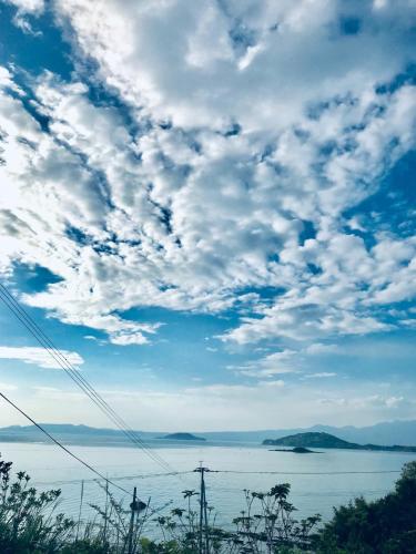 a view of a body of water under a cloudy sky at Tenya - Vacation STAY 34204v in Kami Amakusa
