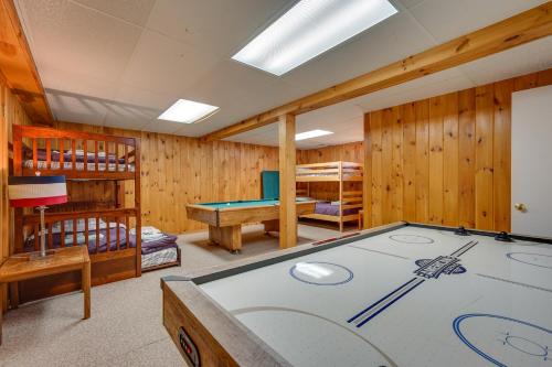 un tavolo da biliardo in una stanza con pareti in legno di Chic Dover Home with Hot Tub 1 Mi to Golf! a West Dover