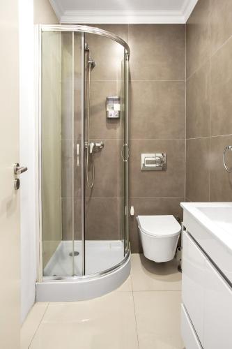 a bathroom with a shower and a toilet and a sink at Apartment in Estrela - Amazing for Families by Lisbeyond in Lisbon