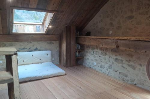 מיטה או מיטות בחדר ב-La Maisonnette d'Archiane