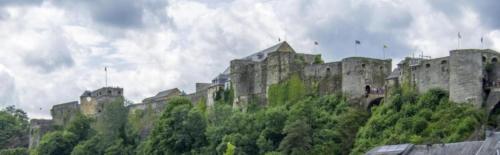 a large castle sitting on top of a hill at Gîte Le Haut des Vannes in Neufchâteau