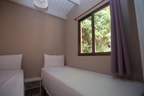 Katil atau katil-katil dalam bilik di Camping Caledonia