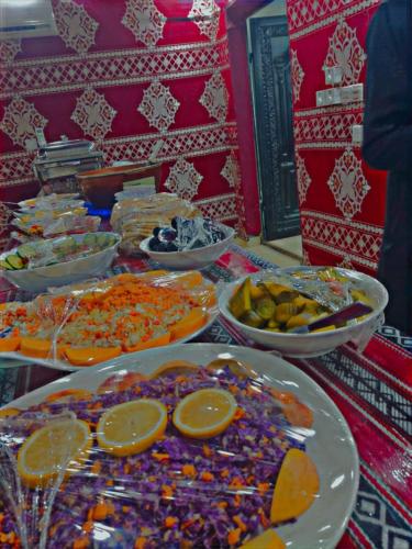 a table with many plates of food on it at Yara camp in Wadi Rum