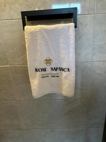 a towel on a towel rack in a bathroom at ROSE SAPANCA STONE HOUSE in Sakarya