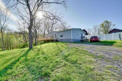 a house on the side of a road with a yard at Chic Seneca Falls Home on Cayuga Wine Trail! in Seneca Falls