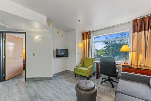 a room with a desk and a chair and a window at Chandler perfect location 1 bedroom in Chandler