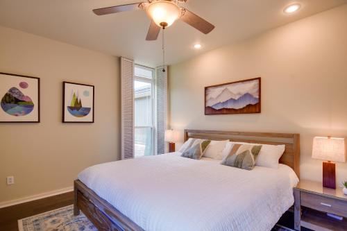 a bedroom with a bed and a ceiling fan at Mid-Century Modern Home with Fire Pit and Gas Grill! in Amarillo